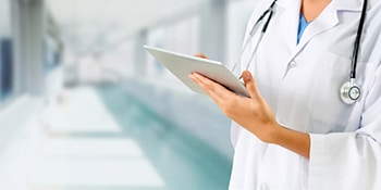 bigstock Doctor Using Tablet Computer A 265913938