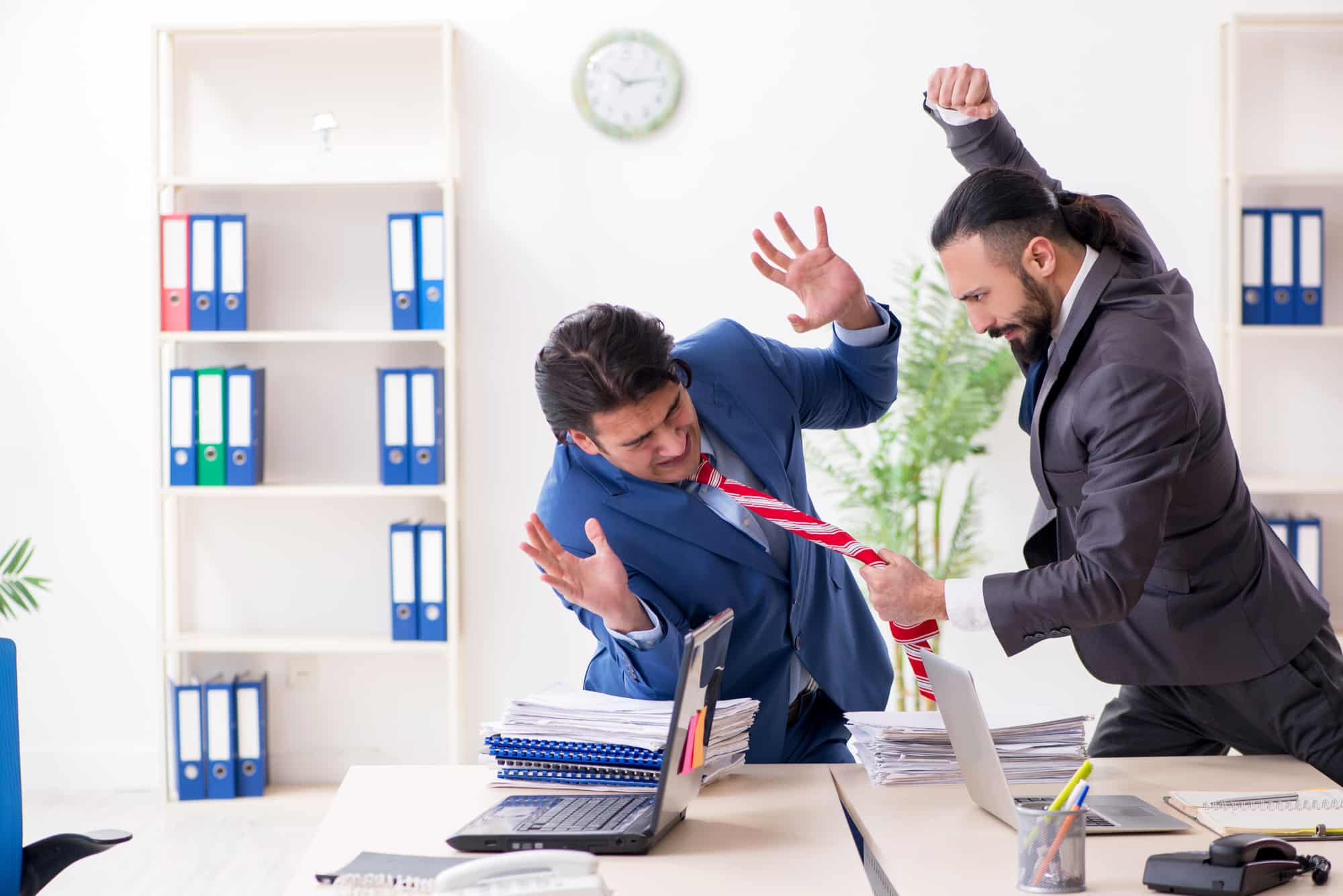Two male colleagues in the office: Workplace Violence.